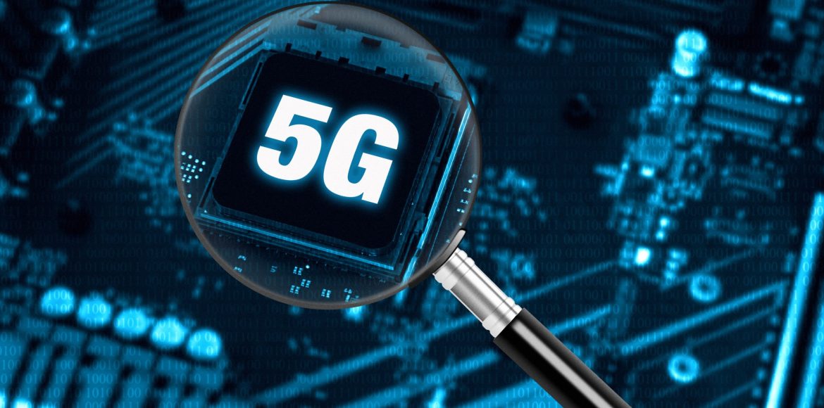 The concept of 5G network with magnifying glass on modern circuit board, high-speed mobile internet and new generation networks technology background