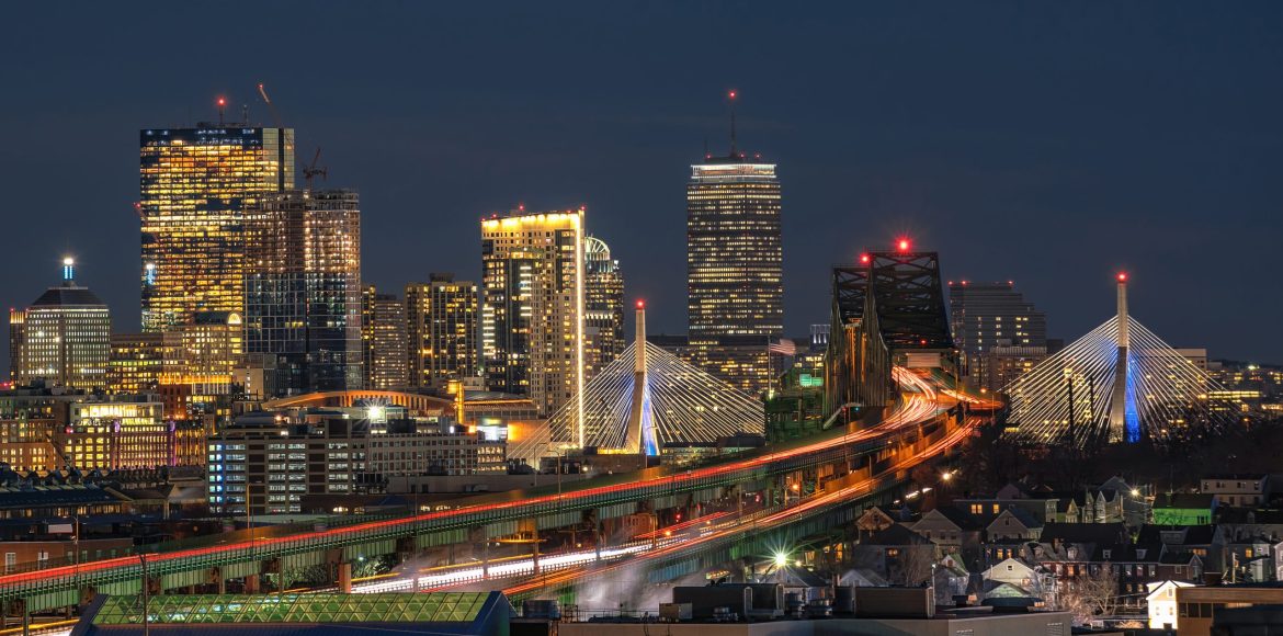 Scene of Boston skyline which can see Zakim Bridge and Tobin Bridge with express way over the Boston Cityscape at twilight time, USA downtown skyline, Architecture and building with tourist concept