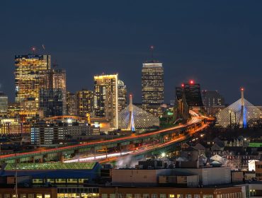 Scene of Boston skyline which can see Zakim Bridge and Tobin Bridge with express way over the Boston Cityscape at twilight time, USA downtown skyline, Architecture and building with tourist concept