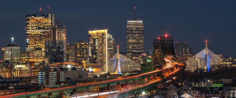 Scene of Boston skyline which can see Zakim Bridge and Tobin Bridge with express way over the Boston Cityscape at twilight time, USA downtown skyline, Architecture and building with tourist concept